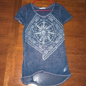 Maurice’s purple and blue shirt